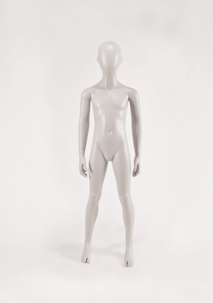 Mannequin by HOL A full-body, featureless, gray plastic mannequin stands upright on a plain white background. Designed with minimal detail, the FK12 model from Farringdon Kids features a smooth, rounded head with no facial features and arms that hang naturally by its sides.